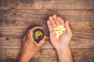 supplements in man's palm