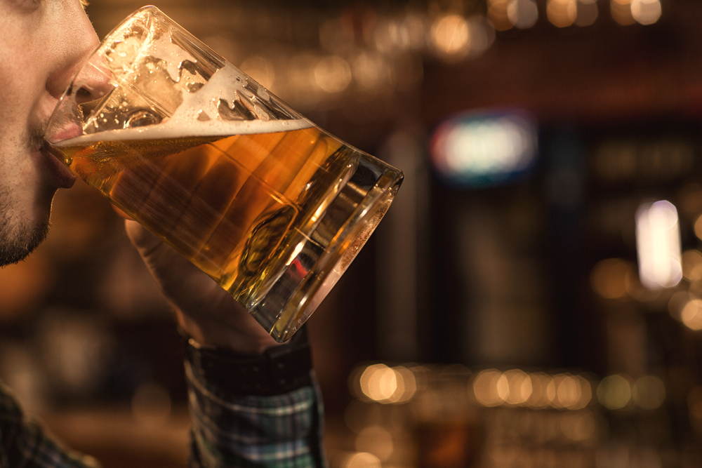 man drinking beer