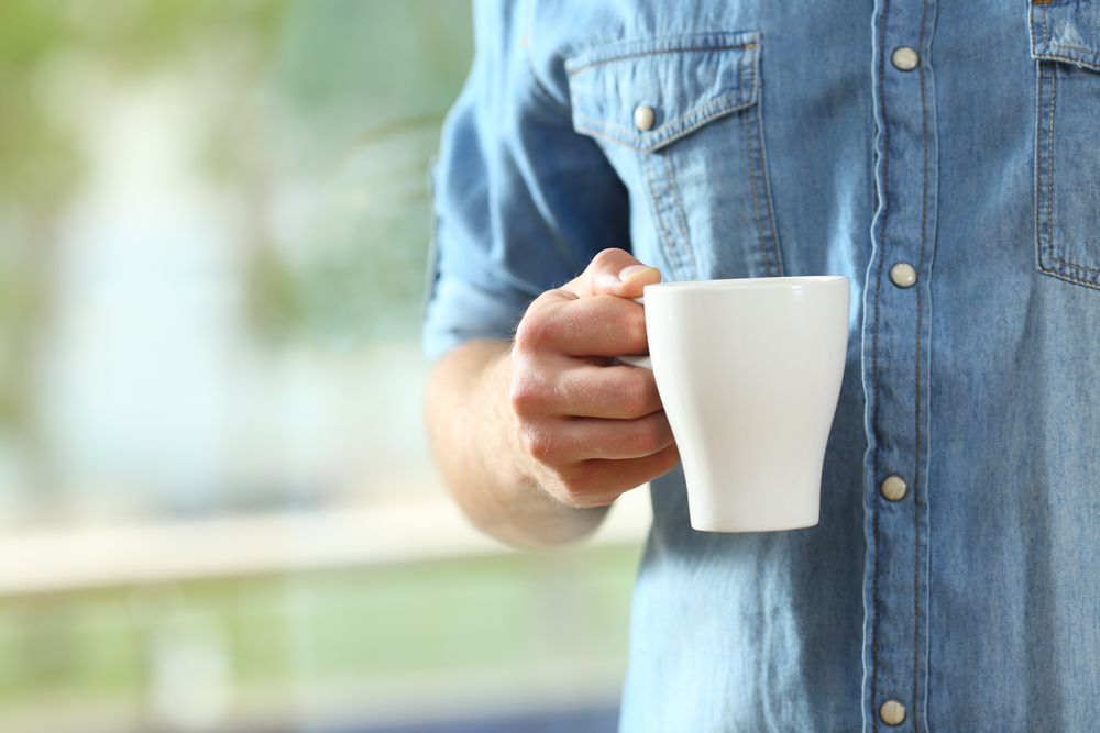 having his morning coffee