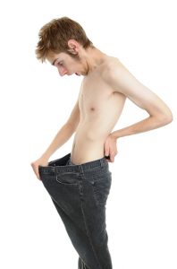 emaciated guy looking down his junk