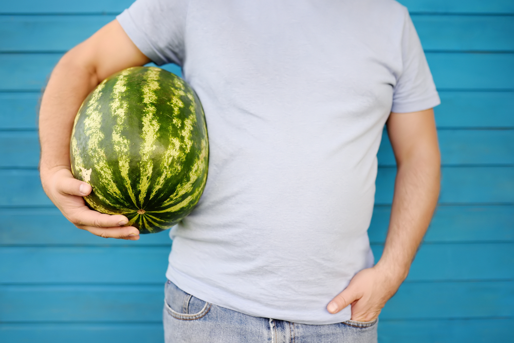 man holding watermelon