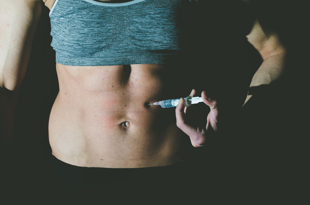 woman injects anabolic steroid