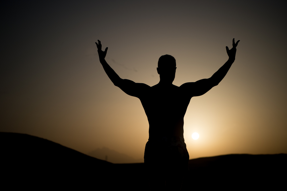 toned physique against sunset