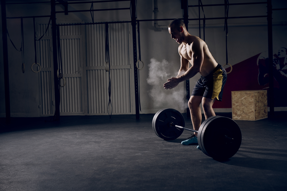 man prepares for deadlift