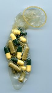 supplement capsules inside condom