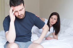 woman consoles sad husband