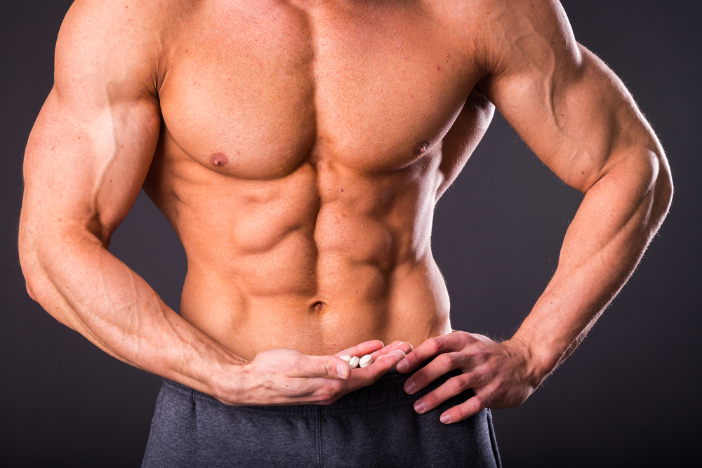 buff guy holds male enhancement pills