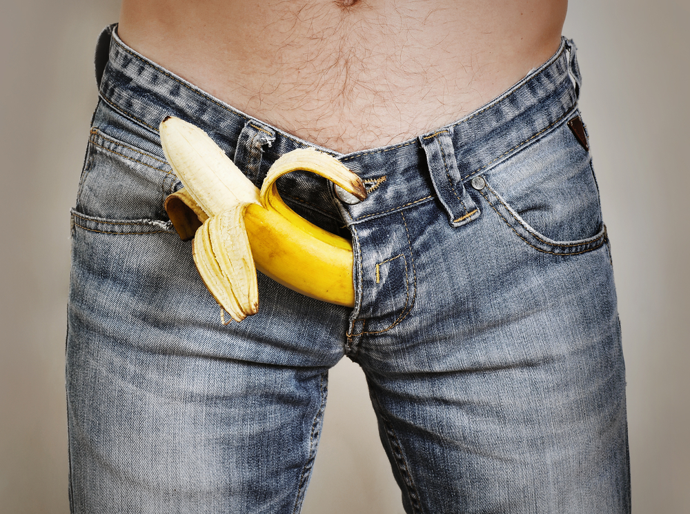 banana sticking out of man's jeans