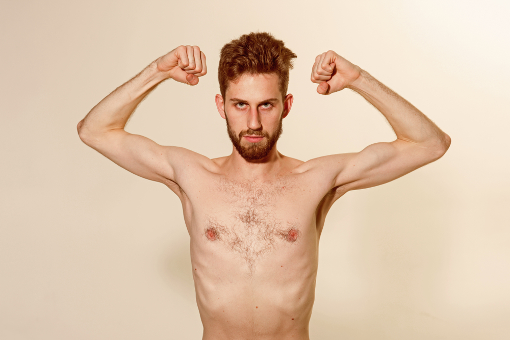 lanky guy flexing.