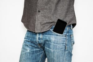 mobile phone on front jean pocket