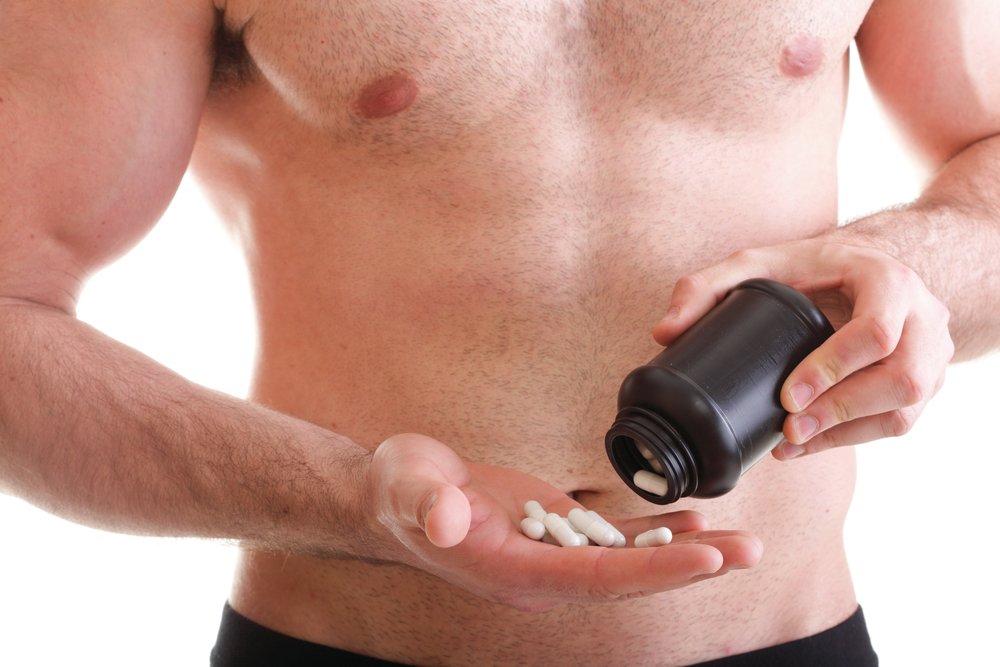 man taking enhancement supplements