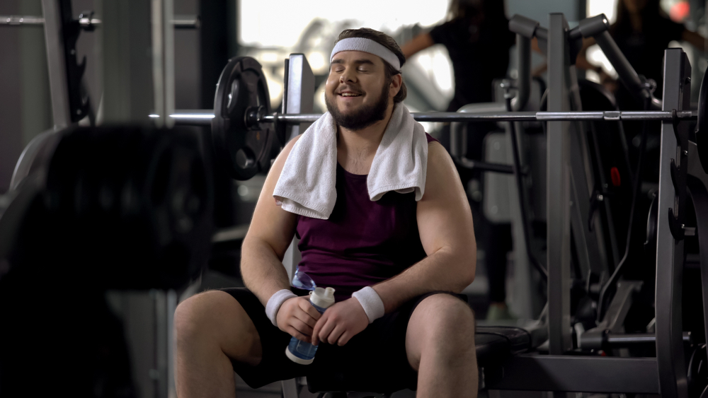 fat man exercising in gym