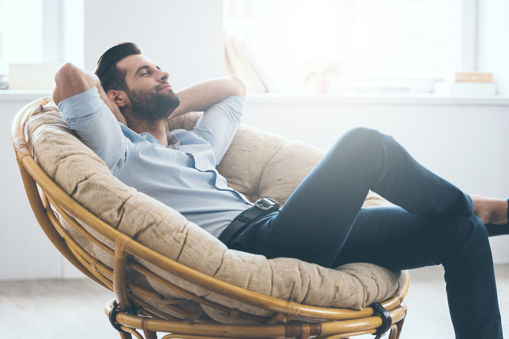 man relaxing in the lounge