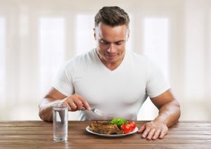 muscular man eating right