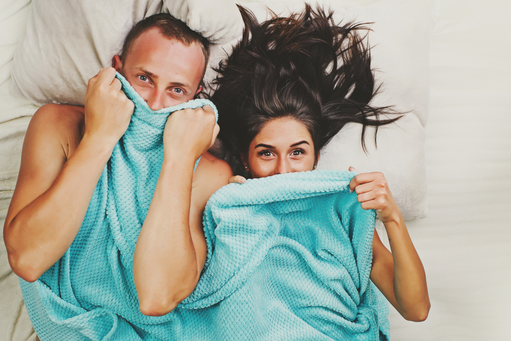 couple fun under the covers