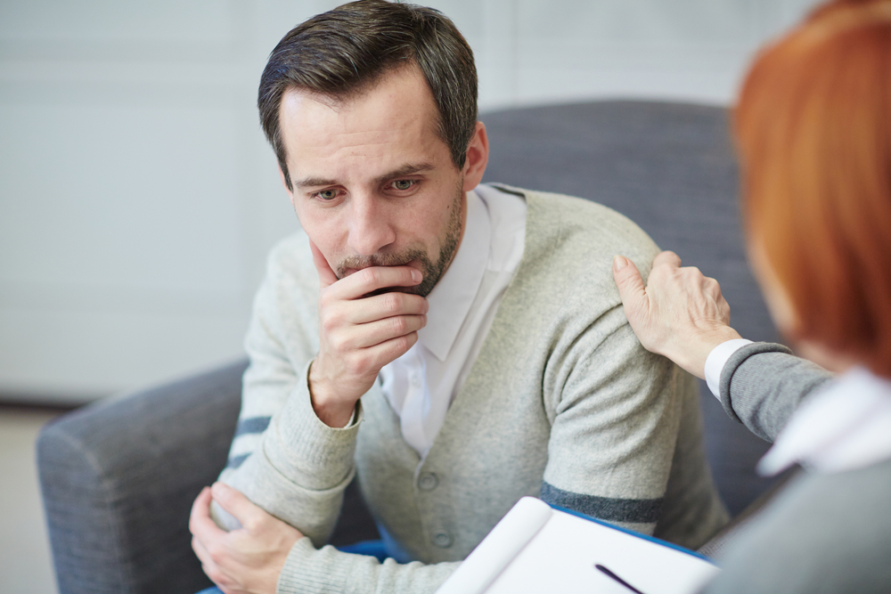 middle aged man consulting doctor