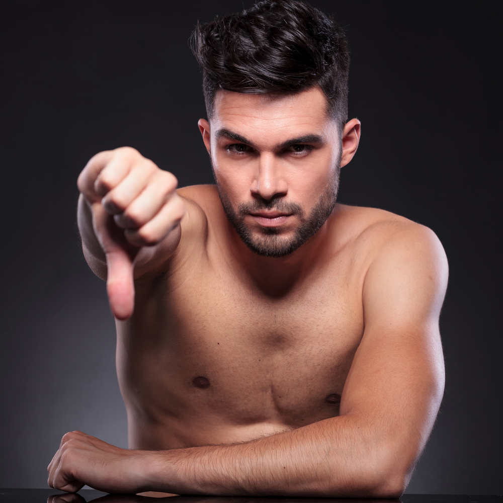 shirtless man thumbs down