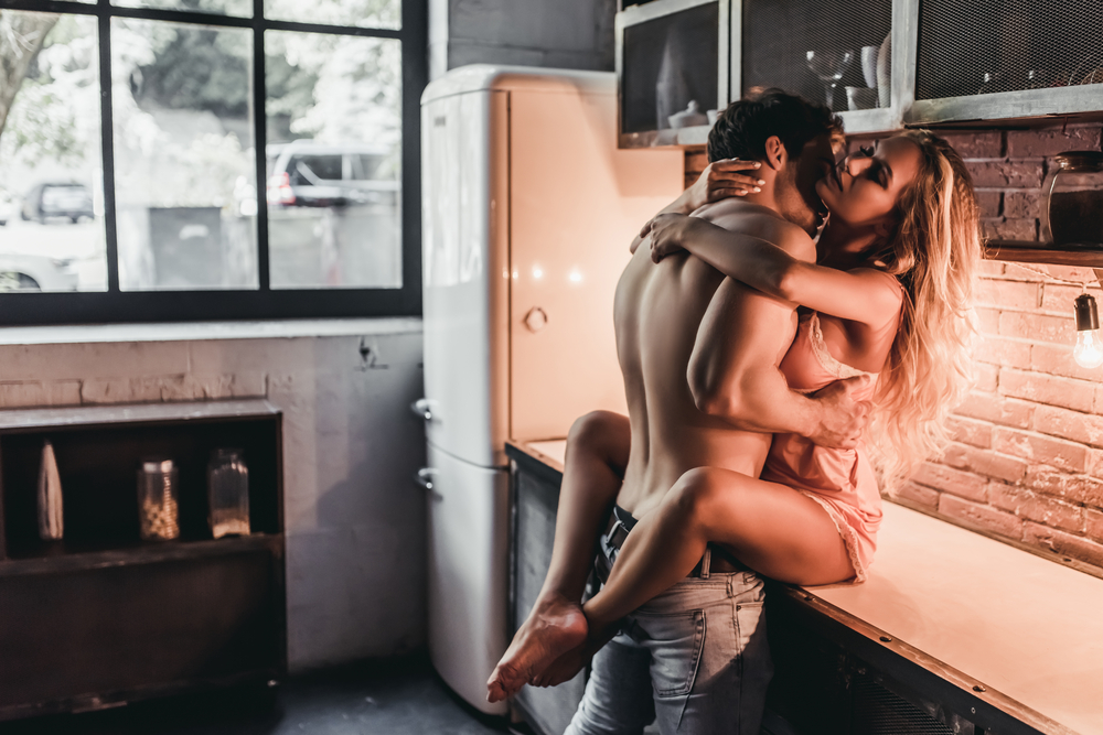 sensual moment on kitchen counter