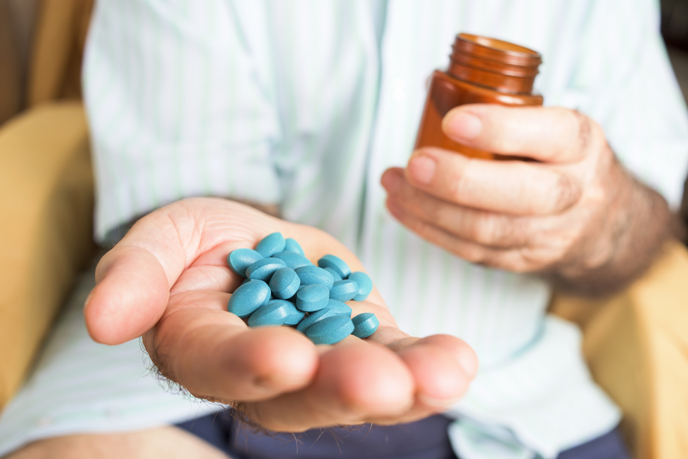 handful of blue ED pills