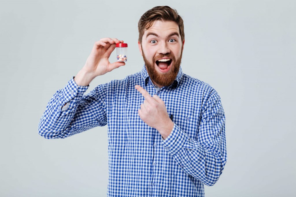 man shows off booster pills