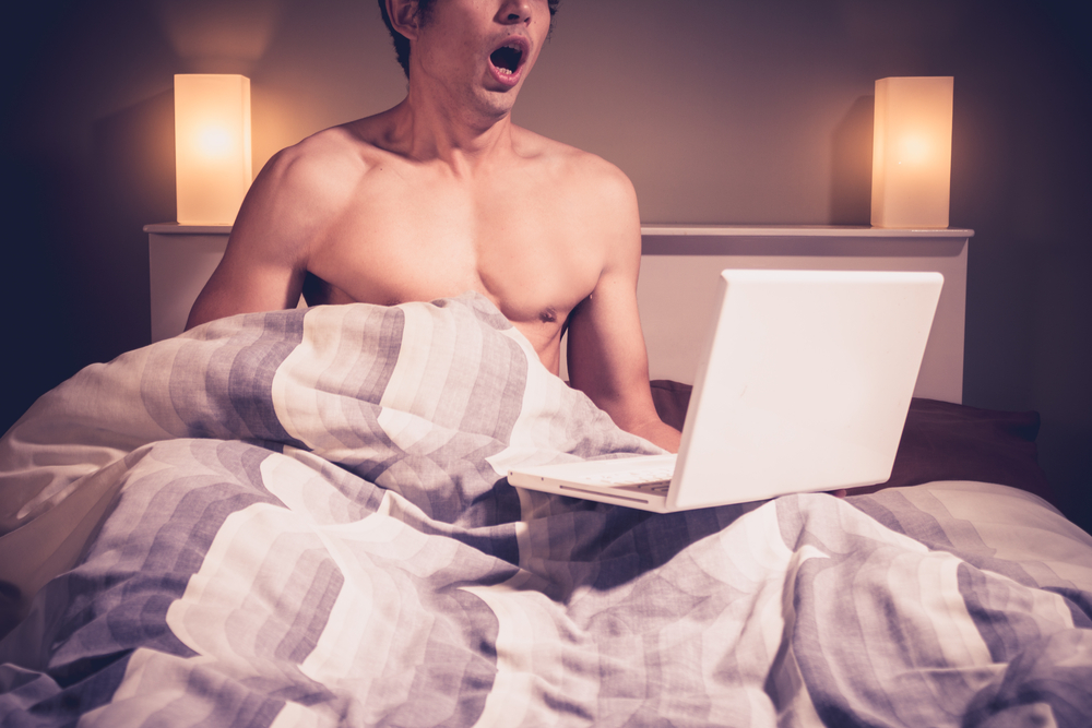 masturbating to online porn in bed