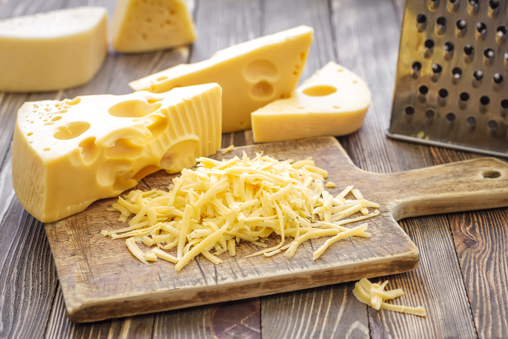 grated cheese on chopping board