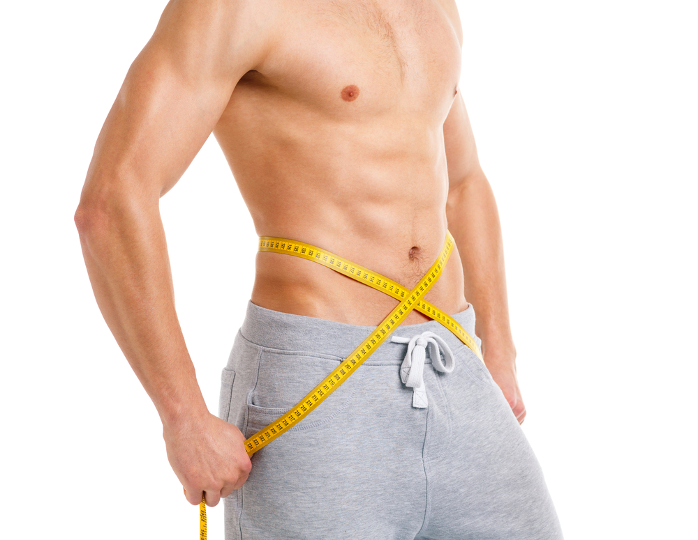 man with six-pack measure waist