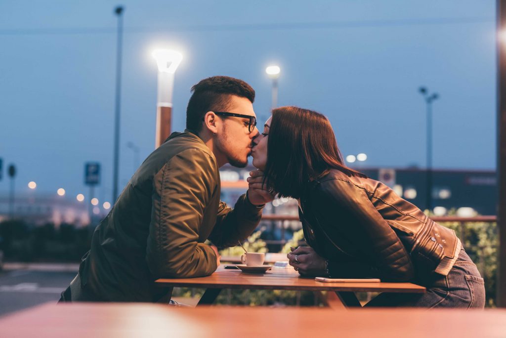 kissing in a coffee shop