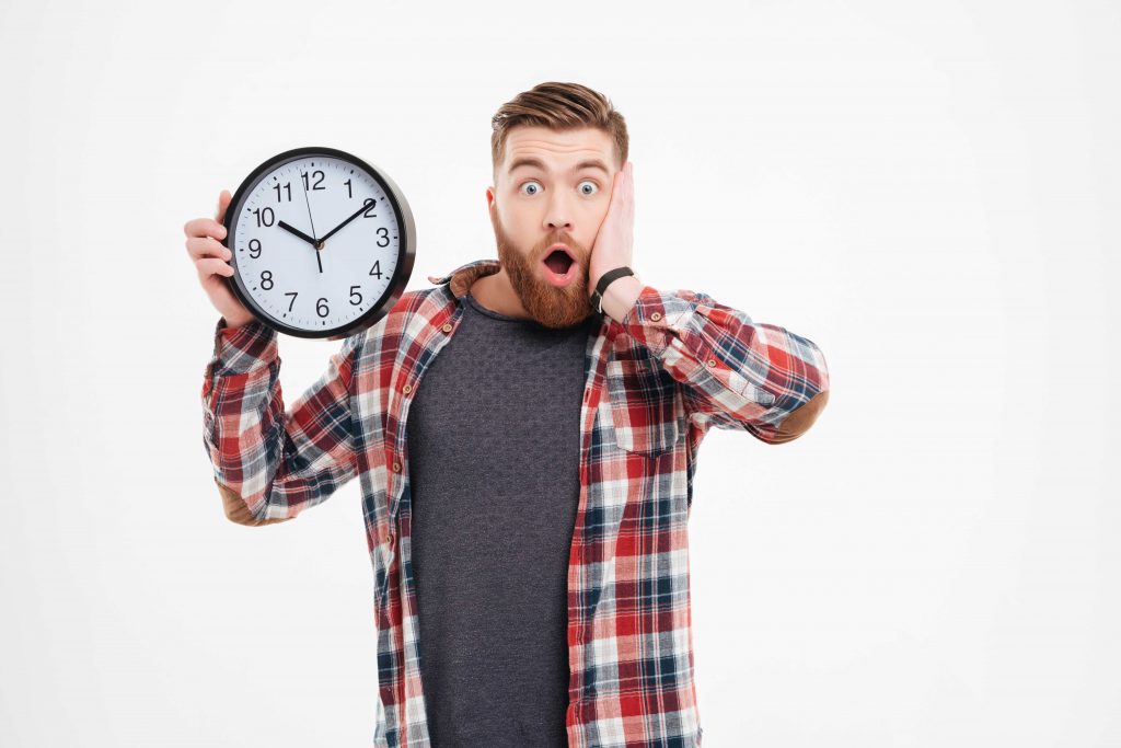 man holding clock