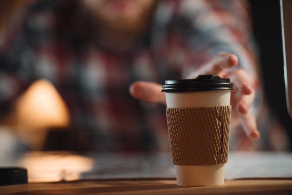 grabbing his cup of coffee