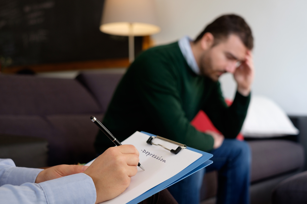 depressed man seeing a shrink