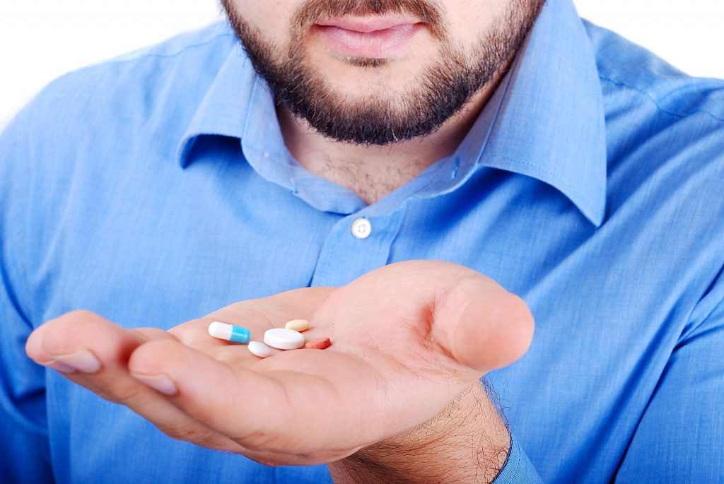 man taking some pills