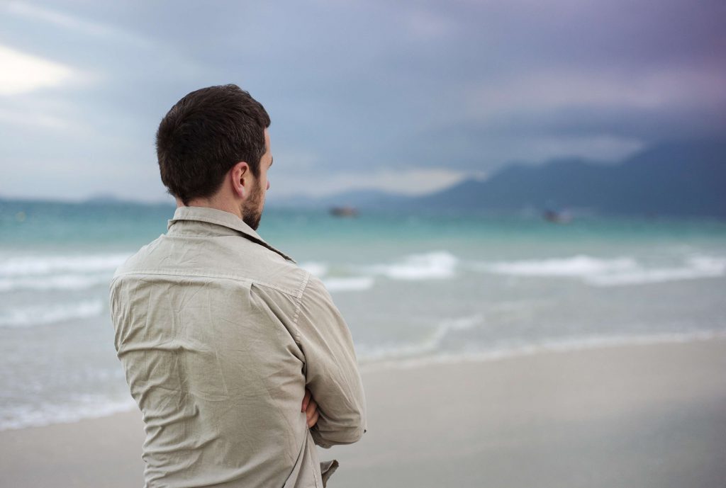 man alone by the beach