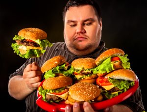 fat man with platter of burger