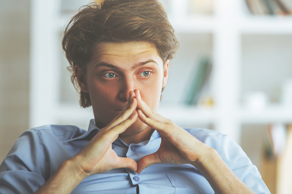 anxious man worrying and thinking