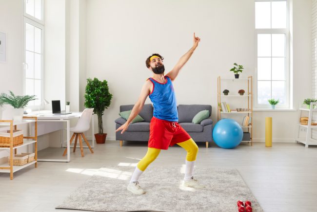 young man in colorful retro sportswear doing fitness exercise